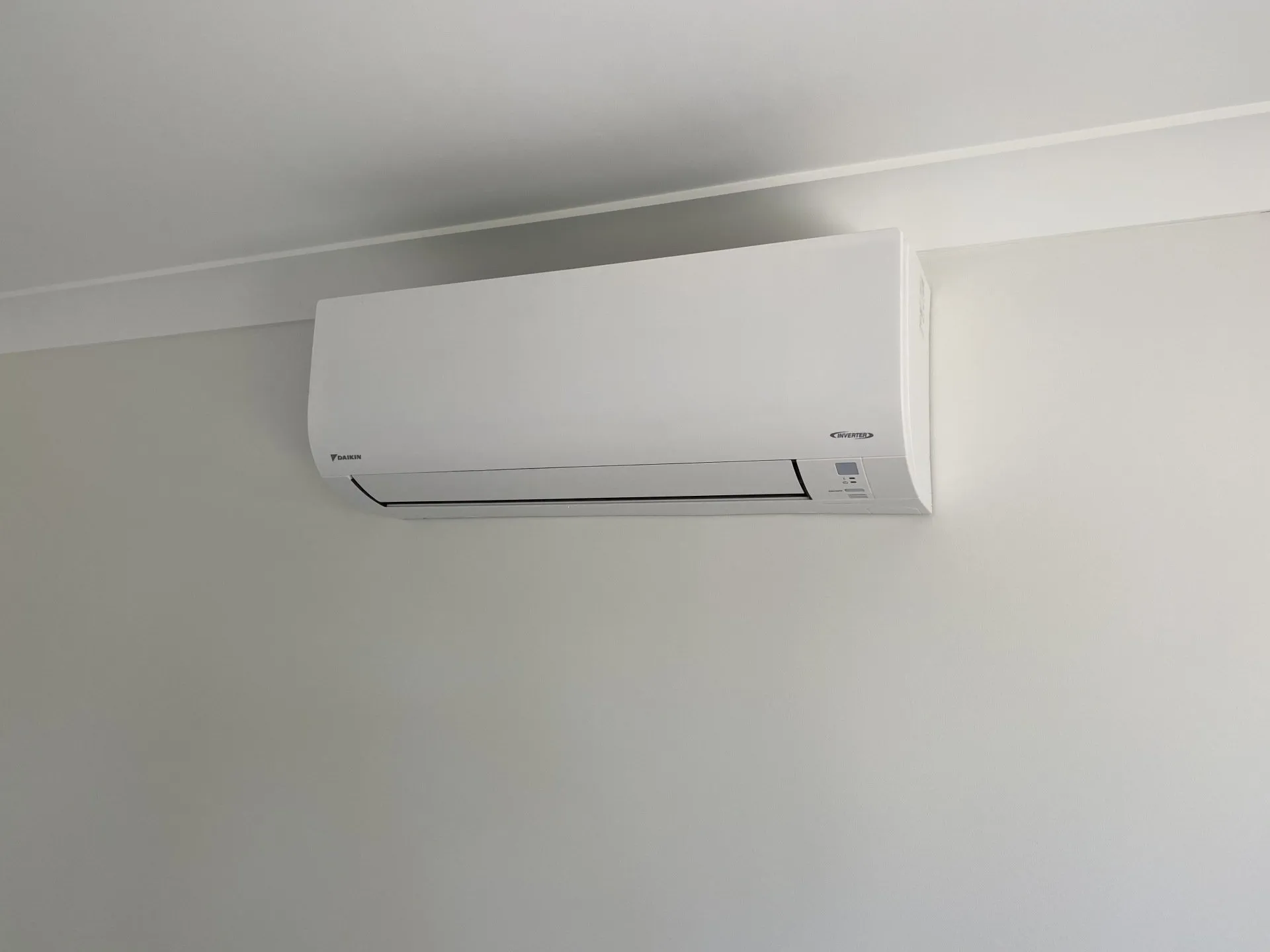 Daikin inverter split-system head neatly installed indoors by On Point Solar & Electrical in a Townsville home