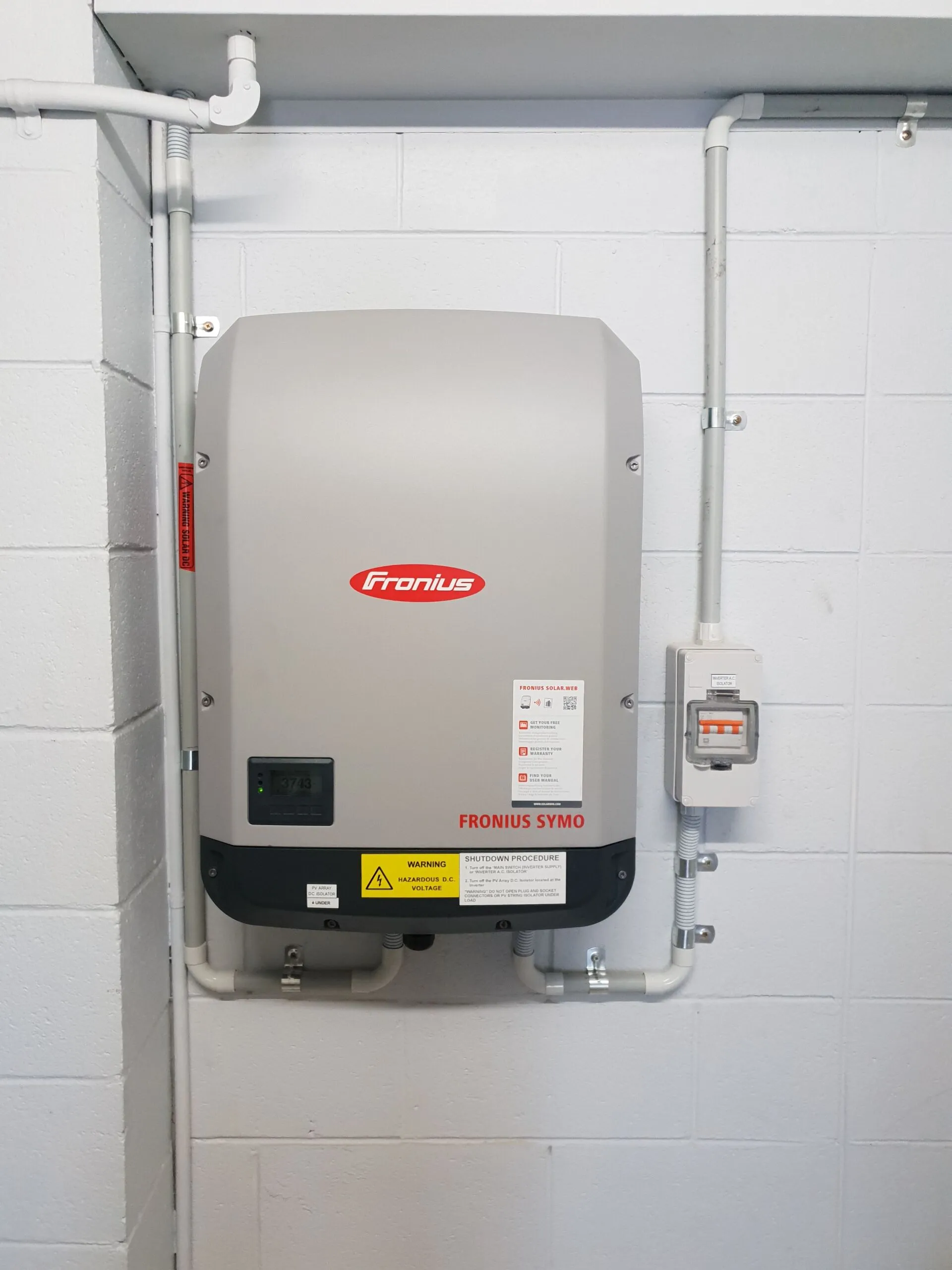 Fronius inverter installation Townsville — a Fronius Symo inverter neatly mounted and wired by On Point Solar