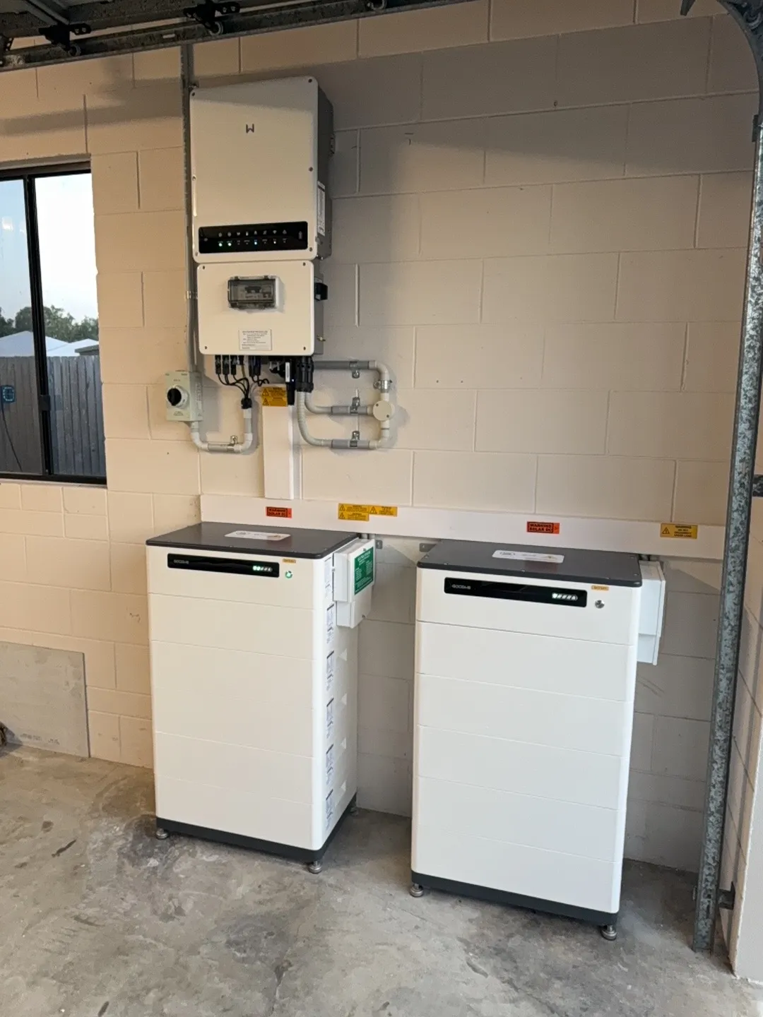 Goodwe hybrid inverter and stacked Goodwe batteries installed by On Point Solar in Townsville