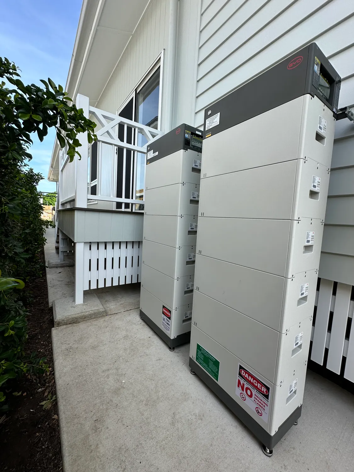 Large outdoor home battery bank installed by On Point Solar beside a Townsville home