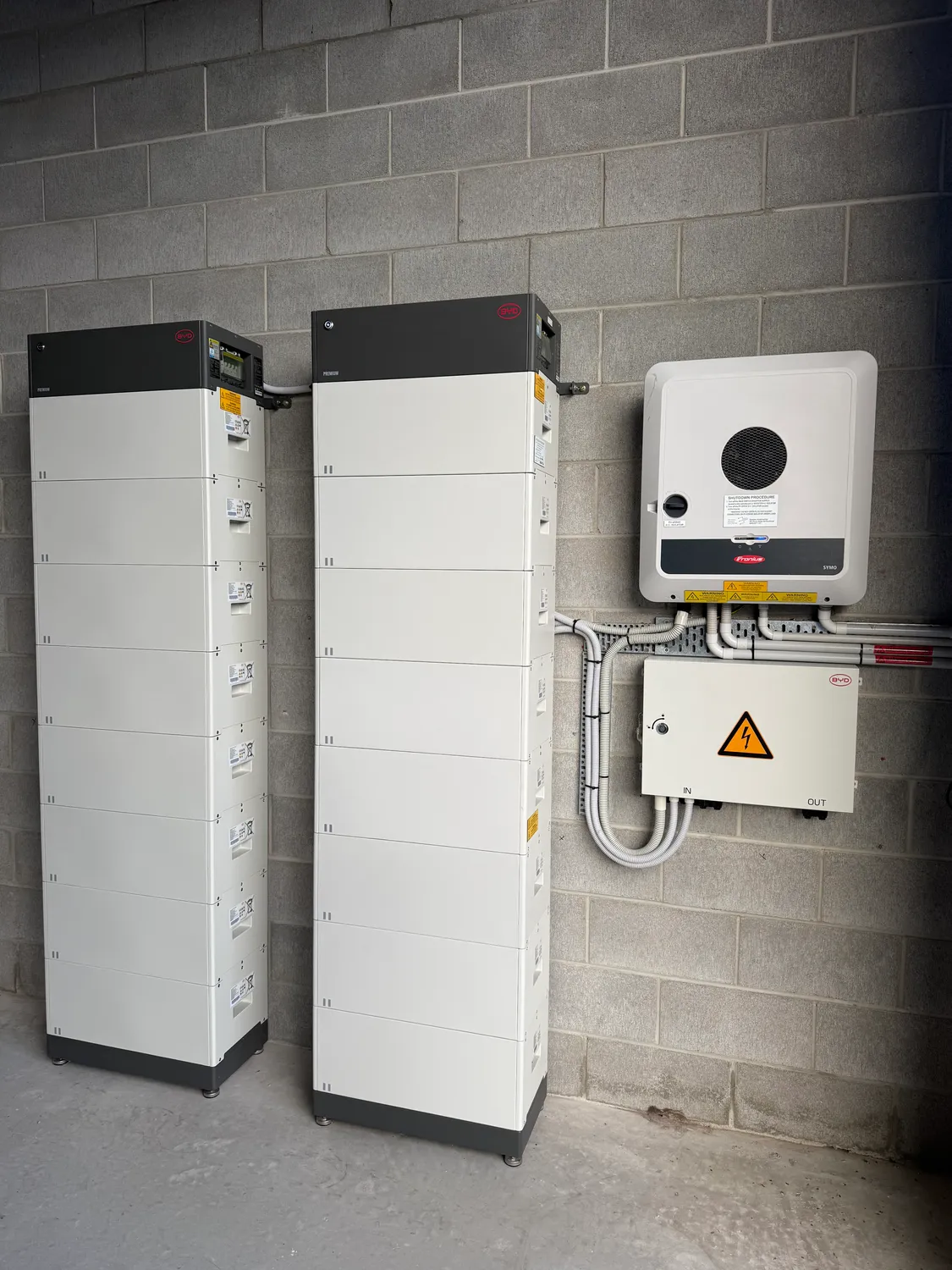 Fronius hybrid inverter and a stacked battery bank neatly installed by On Point Solar in Townsville