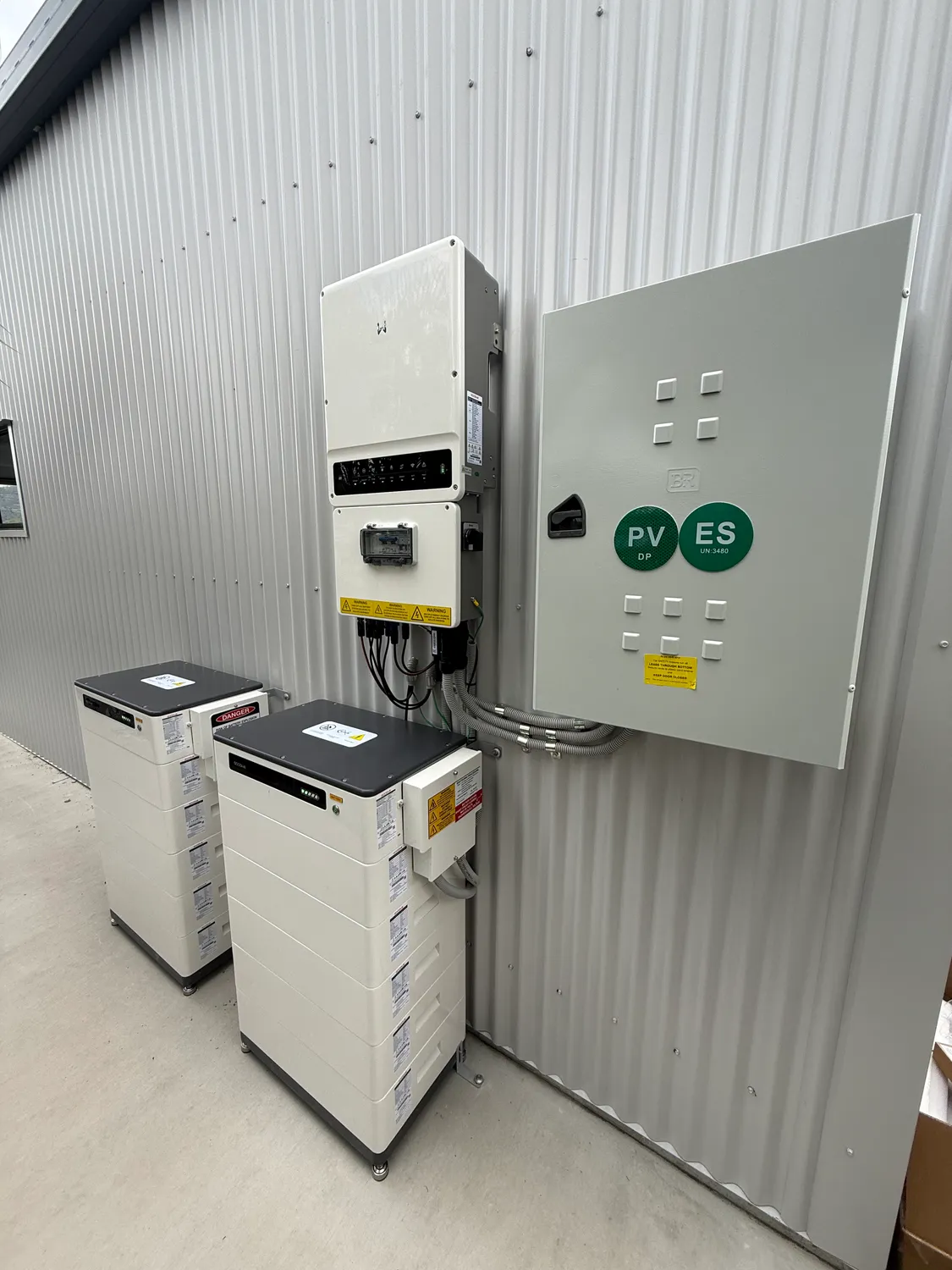 Solar PV and battery DC combiner box and isolators neatly installed by On Point Solar & Electrical in Townsville