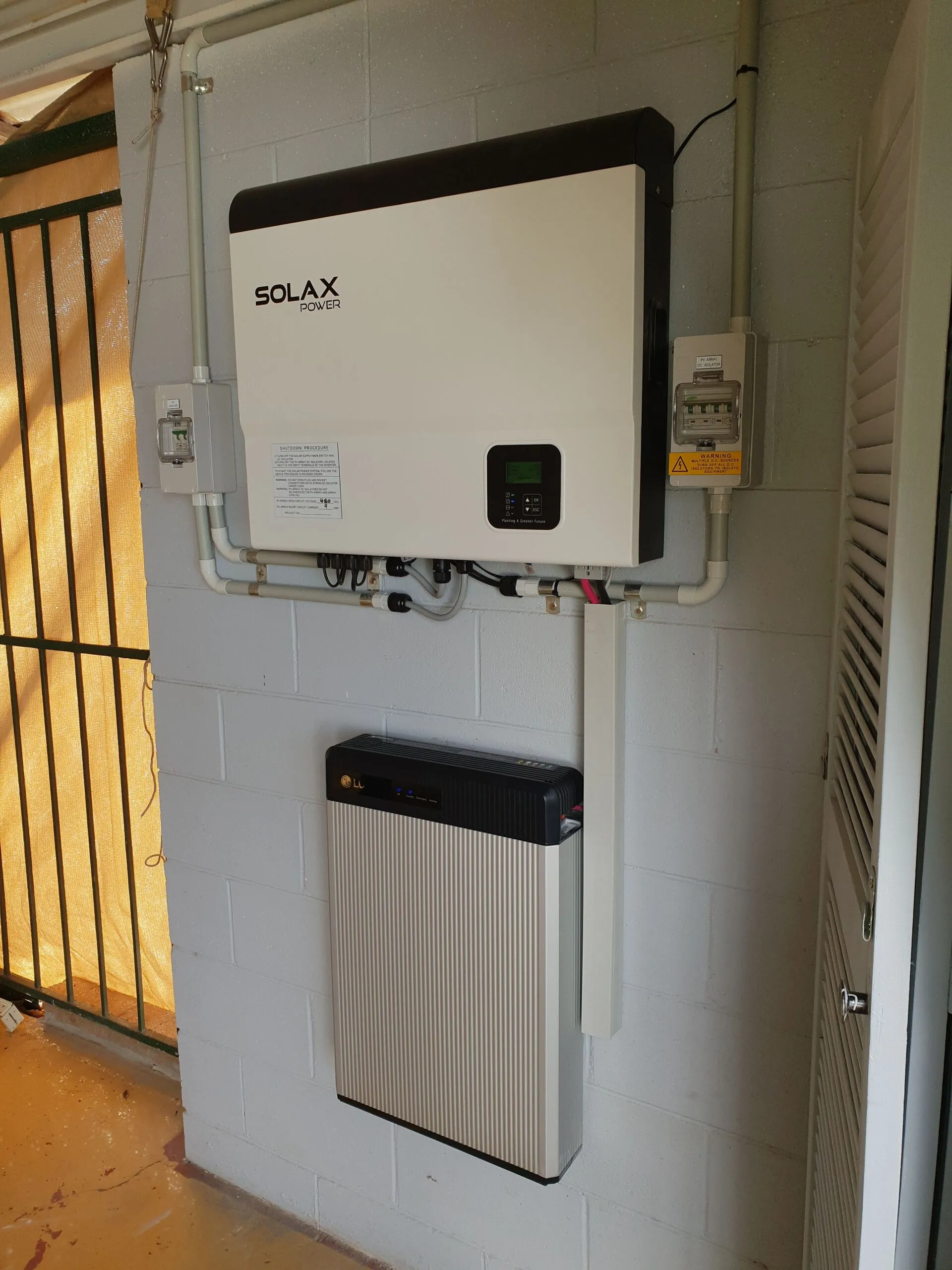 Home energy and charging setup installed by On Point Solar & Electrical in a Townsville garage