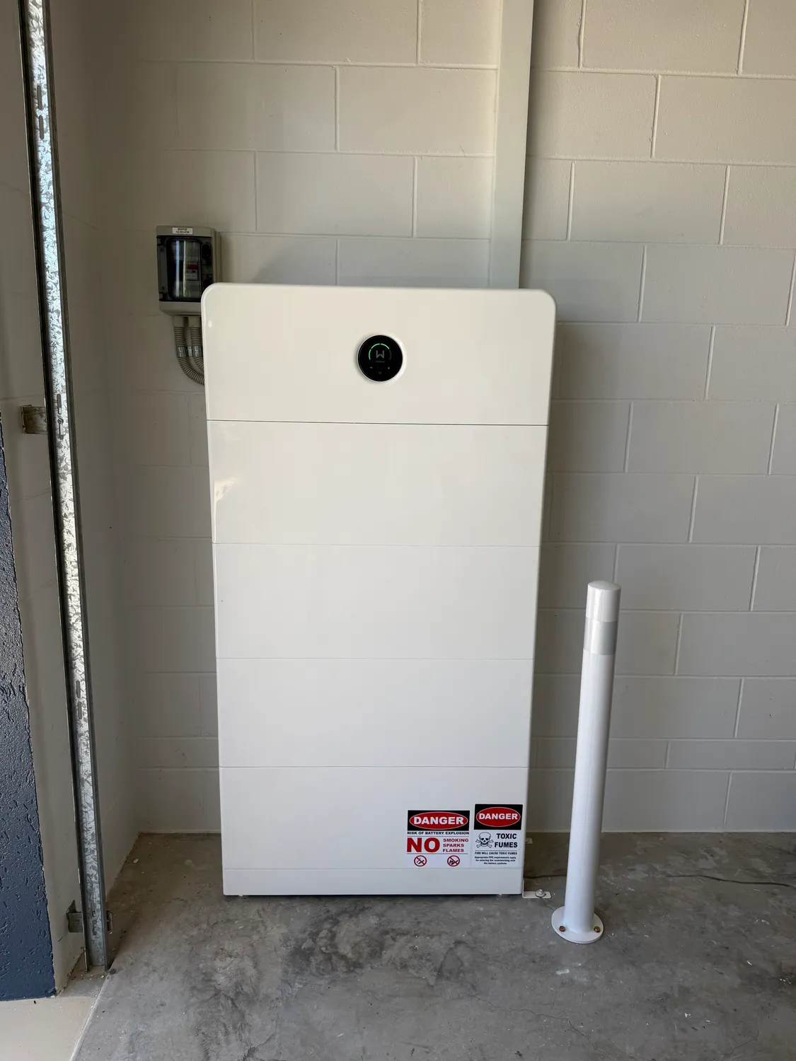 A clean, tidy home battery installation completed by On Point Solar & Electrical in Townsville
